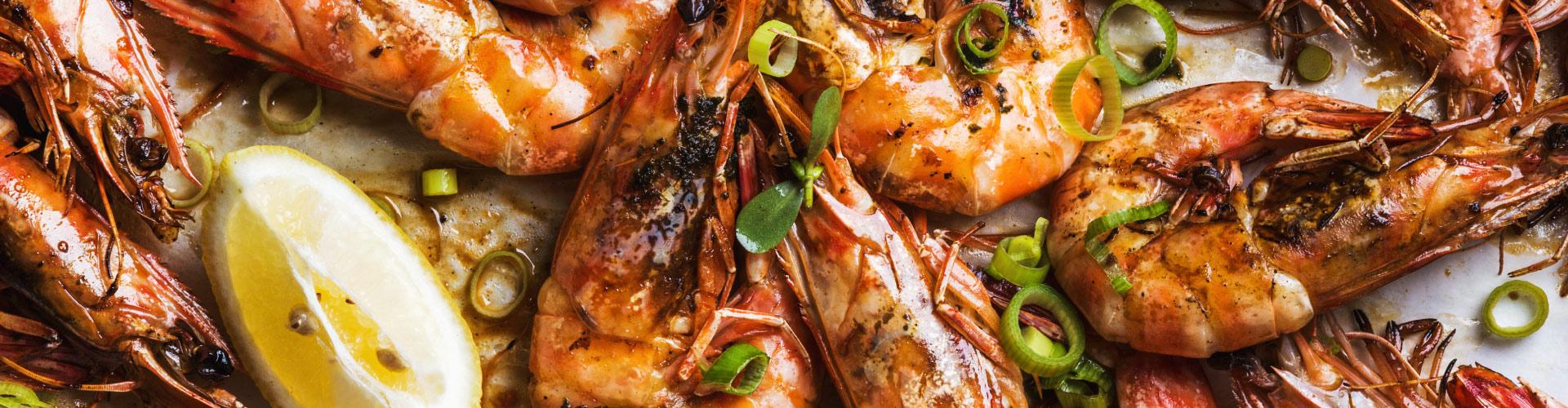 Fresh seafood delivery - grilled prawns with lemon